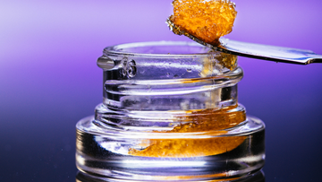 Live resin dab on tool over glass jar